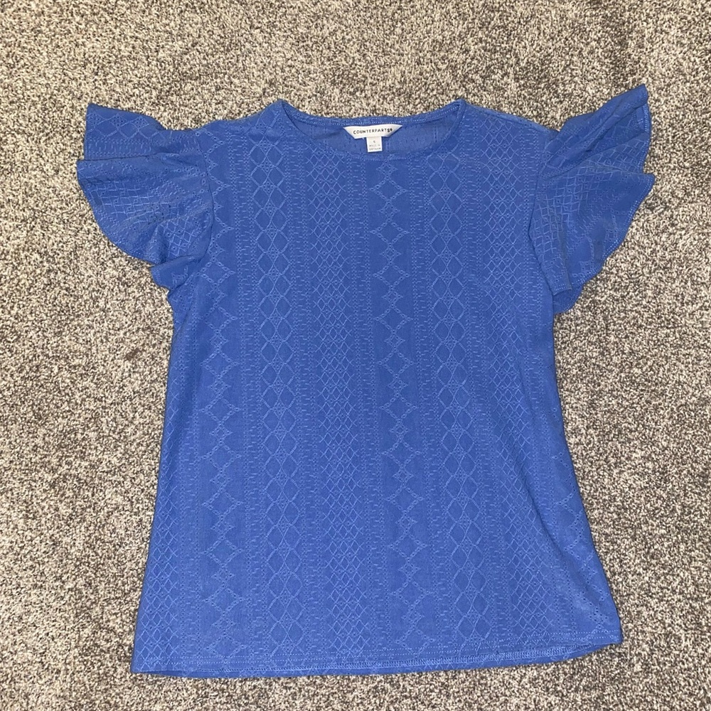 blue top with ruffled sleeves